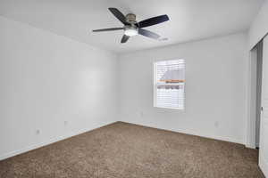 Unfurnished bedroom featuring carpet, a closet, visible vents, and baseboards