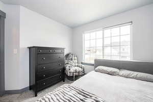 Carpeted bedroom with baseboards