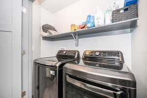 Laundry area featuring washing machine and dryer and laundry area