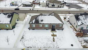 Snowy aerial view with a residential view