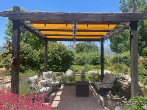 View of patio / terrace with an outdoor hangout area and a pergola