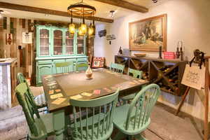 Dining area featuring beamed ceiling