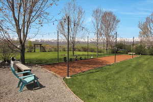 View of home's community featuring a yard and a mountain view