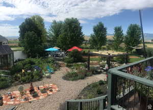 View of yard featuring fence and a mountain view