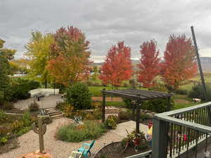 View of home's community with a patio area and a pergola