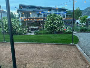 View of community with a yard and a mountain view