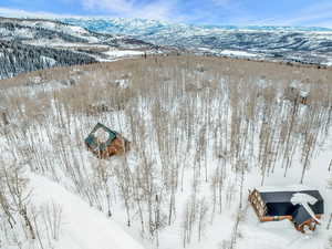 Snowy aerial view featuring a mountain view