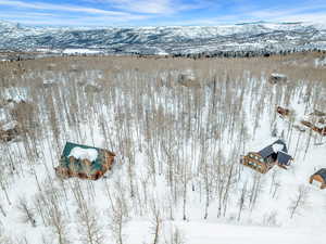 Snowy aerial view with a mountain view