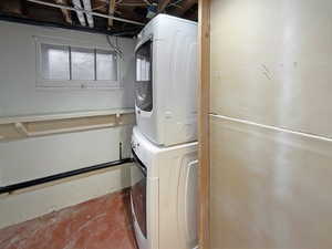 Laundry room with laundry area and stacked washing maching and dryer