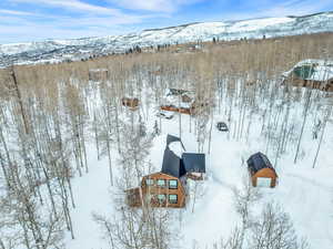 Snowy aerial view with a mountain view