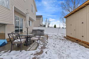 Fully fenced backyard with sprinklers, huge storage shed, patio, and hot tub