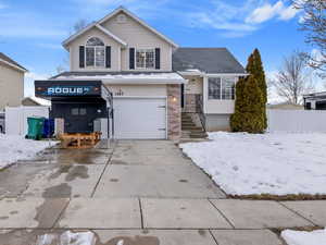 View of front of property with 2 car garage