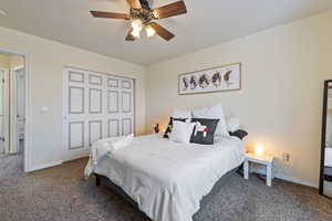 Carpeted primary bedroom with en suite