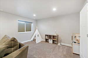 Playroom with carpet floors, visible vents, baseboards, and recessed lighting