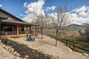 View of yard with a mountain view and a patio area