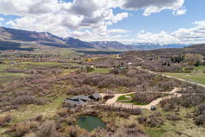 Property view of mountains with a rural view