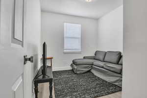 Living room with wood finished floors and baseboards