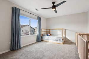 Unfurnished bedroom with carpet flooring, visible vents, and baseboards