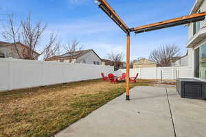 View of yard featuring a fire pit, a patio, and a fenced backyard