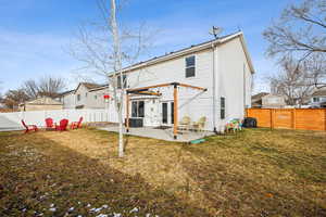 Rear view of property with central AC, a patio, a lawn, and a fenced backyard