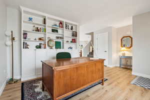 Office featuring light wood-style flooring and baseboards