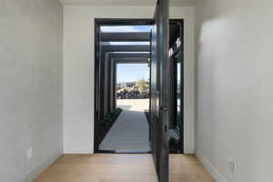 Interior space featuring light wood-style flooring and baseboards