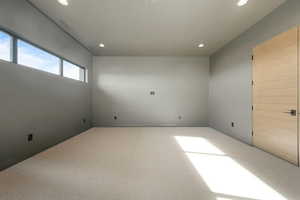 Spare room with visible vents, carpet flooring, and recessed lighting