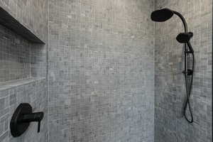 Room details featuring tiled shower