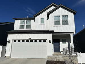 View of front of property with a garage