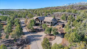 Aerial view with a mountain view and a wooded view