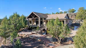 View of front of house with stairs and stucco siding