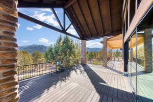 Wooden deck featuring a mountain view