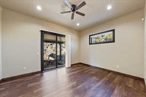 Unfurnished room with visible vents, baseboards, dark wood-style floors, ceiling fan, and recessed lighting