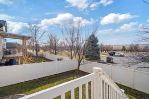 View of yard featuring a fenced backyard and stairway