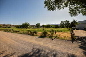 View of street featuring a rural view and a mountain view