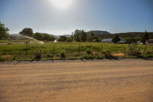 View of yard with a mountain view and a rural view