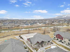 Drone / aerial view with a residential view and a water and mountain view