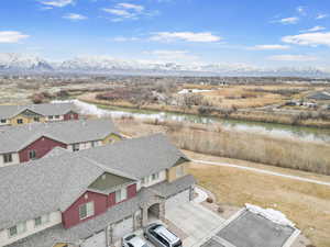 Birds eye view of property featuring a residential view and a water and mountain view