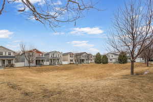 View of yard featuring a residential view and fence