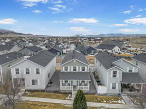 Drone / aerial view featuring a mountain view and a residential view