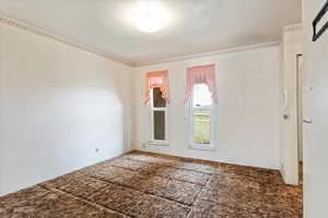 Carpeted spare room with a textured ceiling