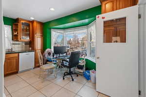 Tiled office space featuring sink