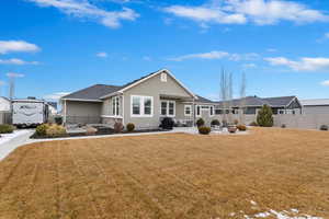 Back of house with a patio, fence, a residential view, and stucco siding