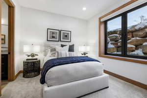 Bedroom with recessed lighting, baseboards, and light colored carpet