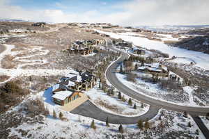 Snowy aerial view with a residential view