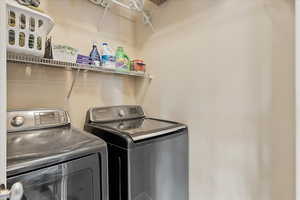 Laundry room with laundry area and washer and dryer