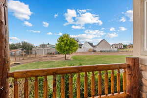 View of yard featuring a residential view and fence