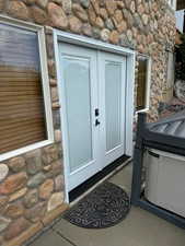 Property entrance featuring french doors