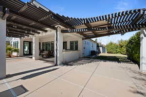 View of patio / terrace with cooling unit and a pergola