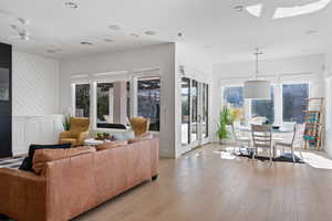 Living room with light hardwood / wood-style floors